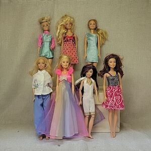7 Hasbro Mattel 11" Barbie dolls (3)